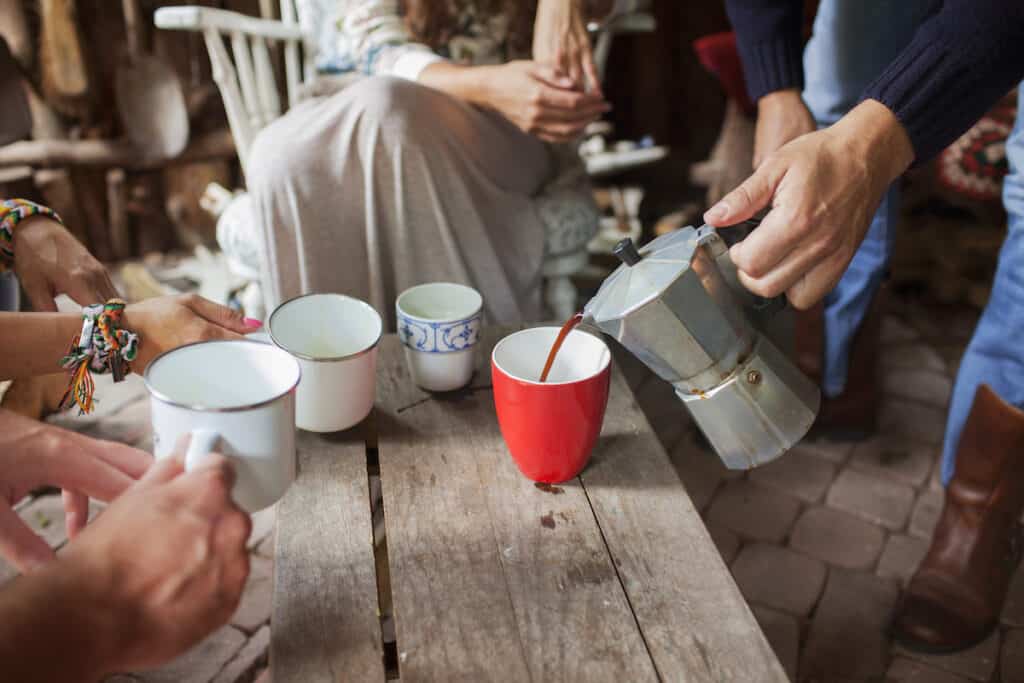Italian coffee etiquette - image showing a ritual of sharing coffee amongst friends